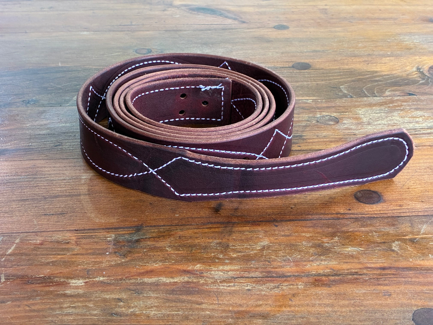 Stitched latigo straps